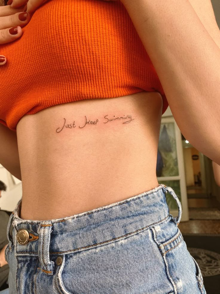 Small Cursive Script Tattoo